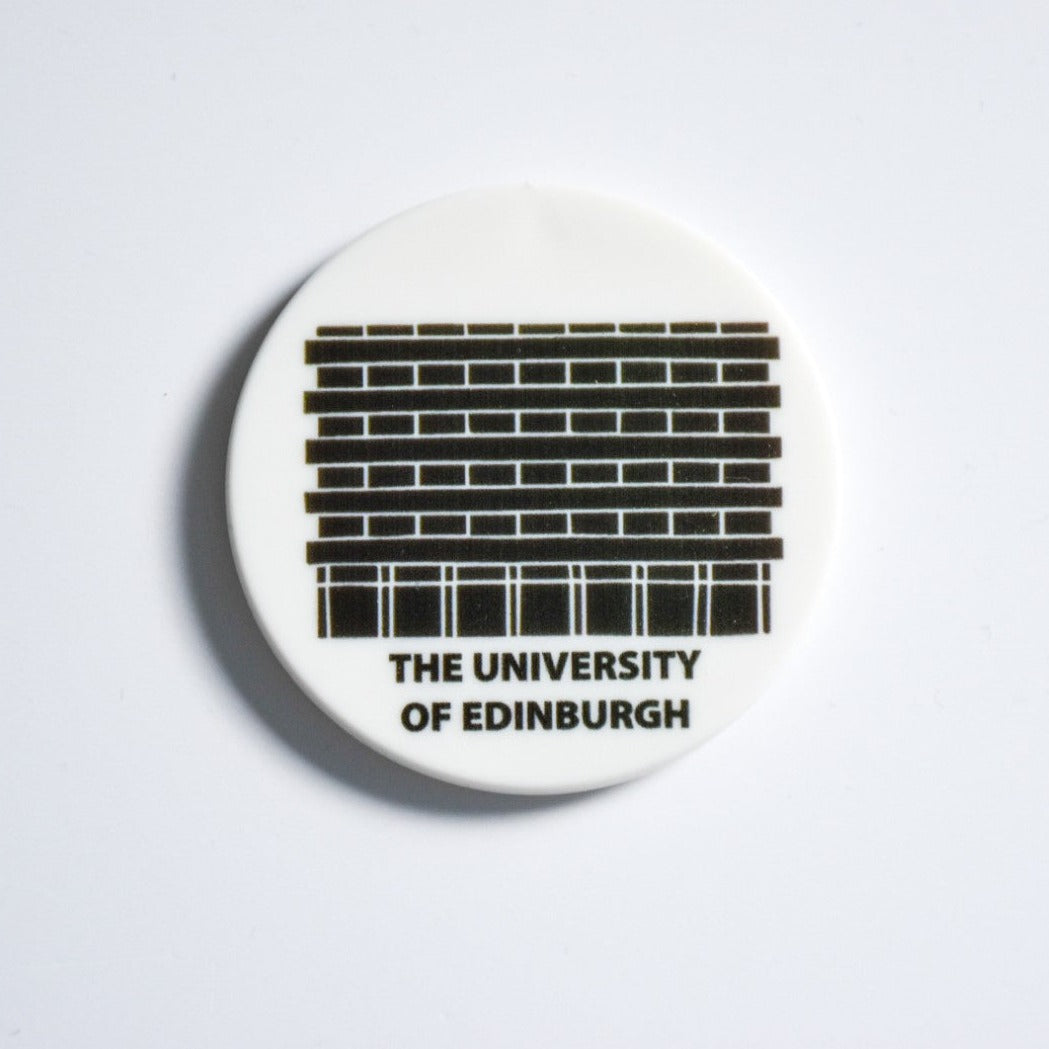 Circular magnet of a black and white design of the University of Edinburgh's Library