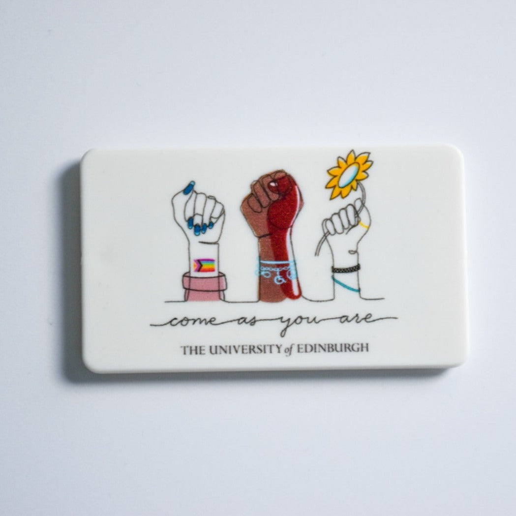 Rectangular magnet with a design of three fists and text that reads 'come as you are.'