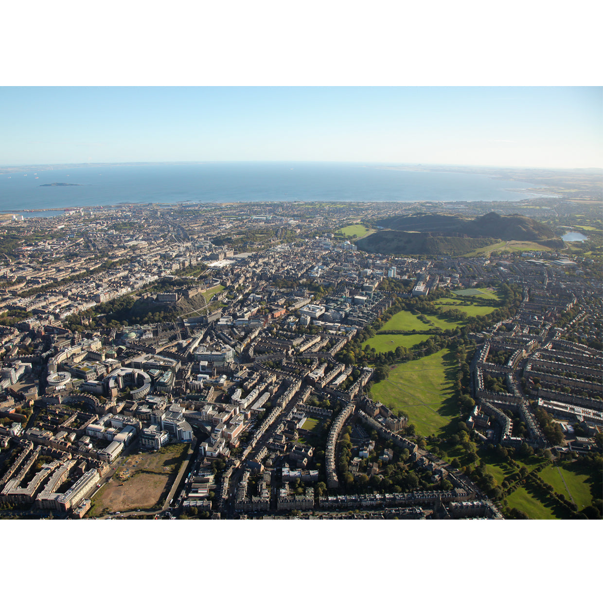 Aerial photograph of Edinburgh from the sky, from the meadows, Arthurs seat and into the Forth