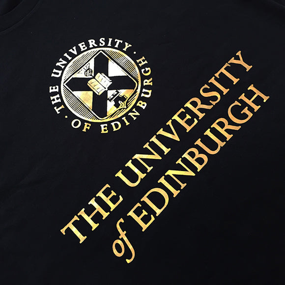 University crest and name printed in bright gold across the chest of the hoodie.