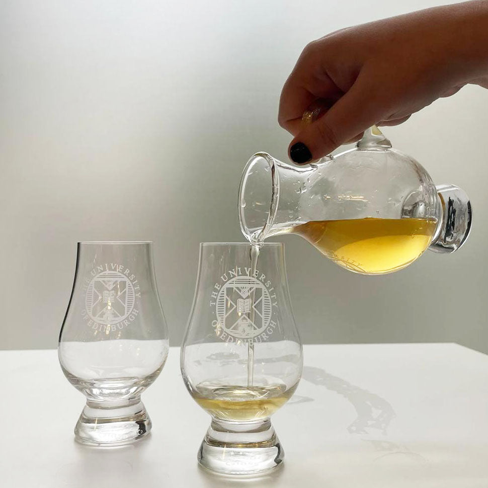 Shot of whisky being poured from a decanter into one of our tasting glasses. 