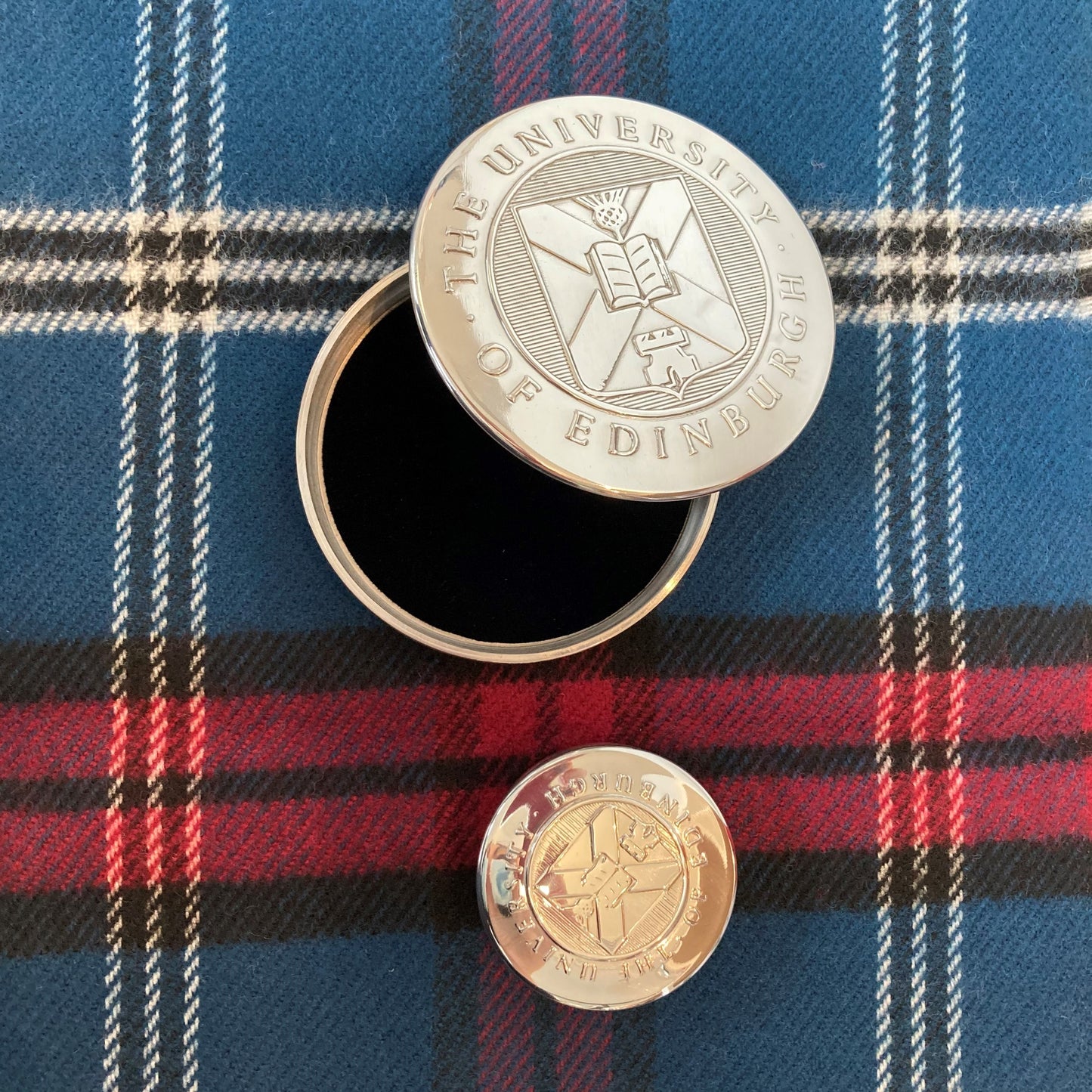 Both sizes of our trinket box displayed on a tartan background. 