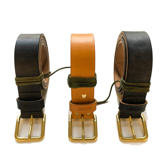 3 Leather belts coiled up in a row. Black and Tan. 