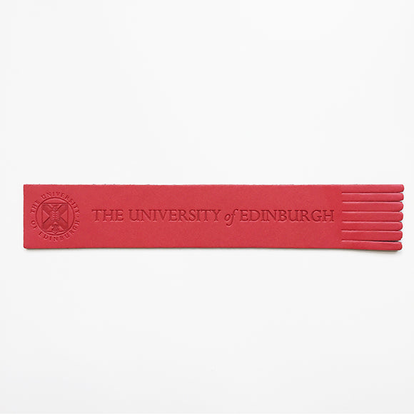 Recycled leather bookmark with embossed University crest in red, front view