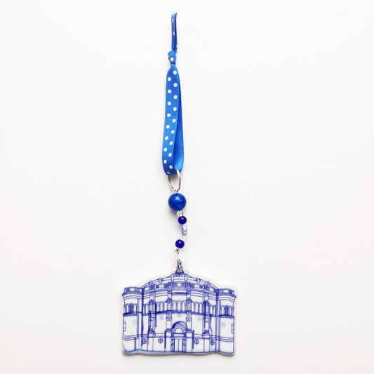 Front view of the McEwan Hall Ceramic Decoration and the blue ribbon with white dots holding it