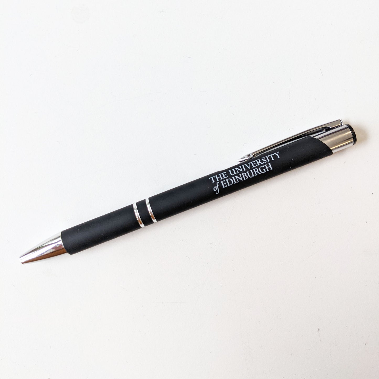 Black soft feel pen with 'The University of Edinburgh' printed on the barrel in white. 