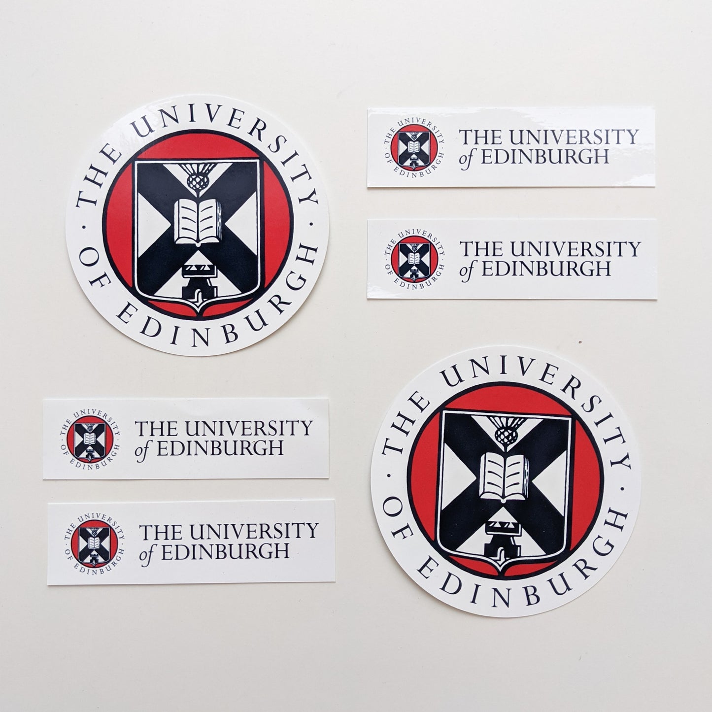 Our Round and Long Window Stickers laid in a pattern on a white background. 