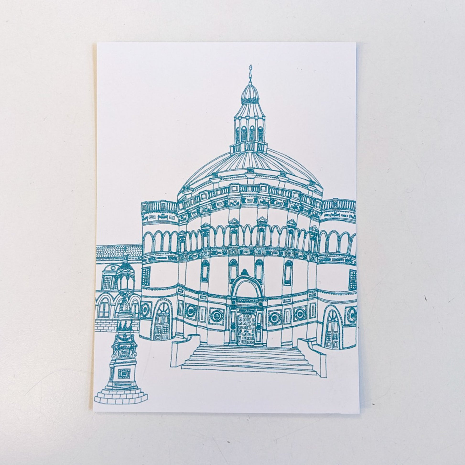 Illustrated postcard of McEwan Hall by Victoria Rose Ball. The lines are in a teal blue, set on a white background. The postcard itself is also set on a white background.