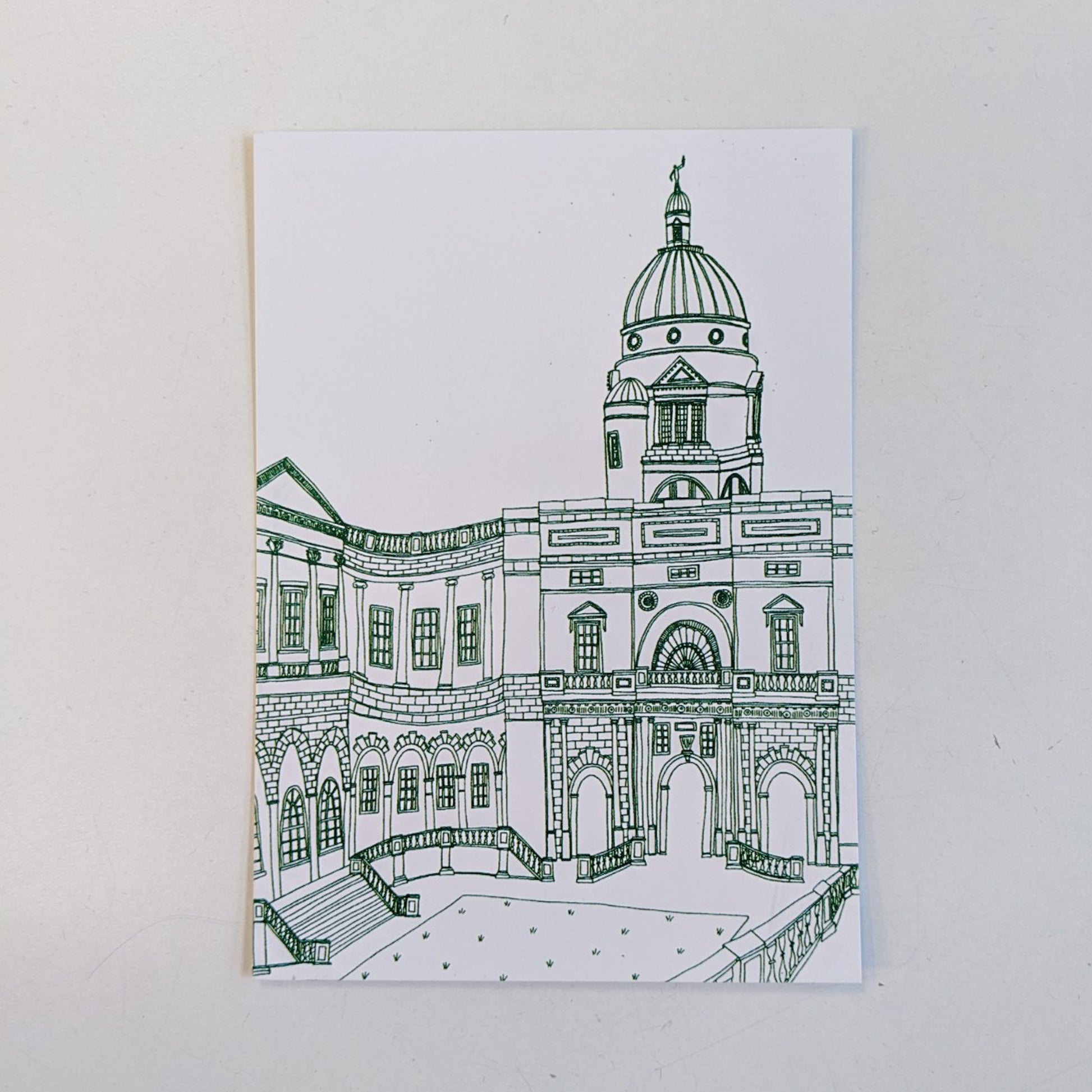 Illustrated image of Old College on a postcard by Victoria Rose Ball. The lines are a dark green, set on a white background. The postcard itself is also set on a white background.