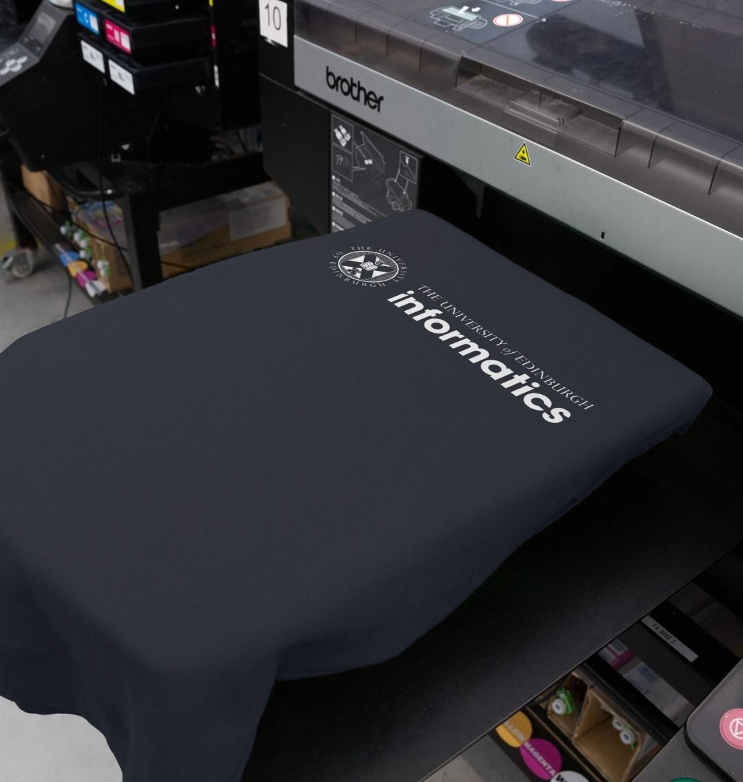 Our School of Informatics Sweatshirt being printed by our print on demand partner, teemill.