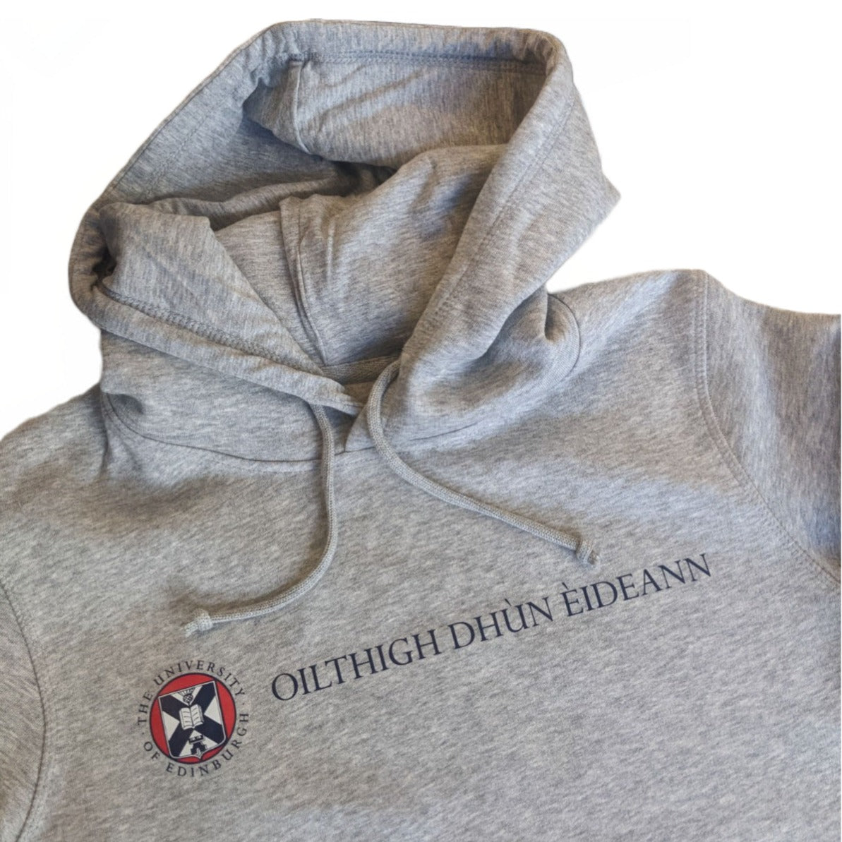 close up of  Grey hoodie with the University name in Gaelic in navy print and university crest in navy red and white print