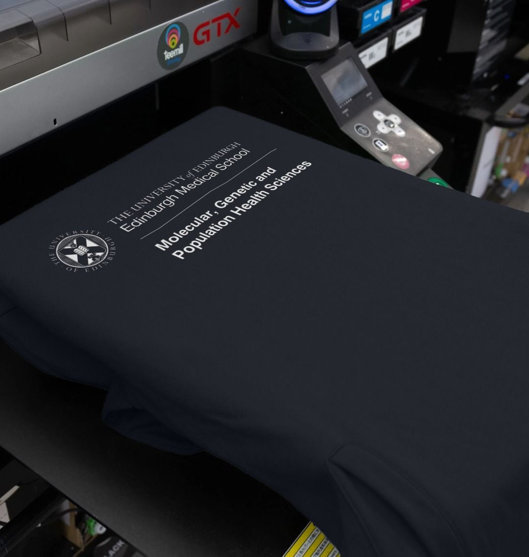 Our Edinburgh Medical School -Molecular, Genetic and Population Health Sciences Hoodie being printed by our print on demand partner, teemill