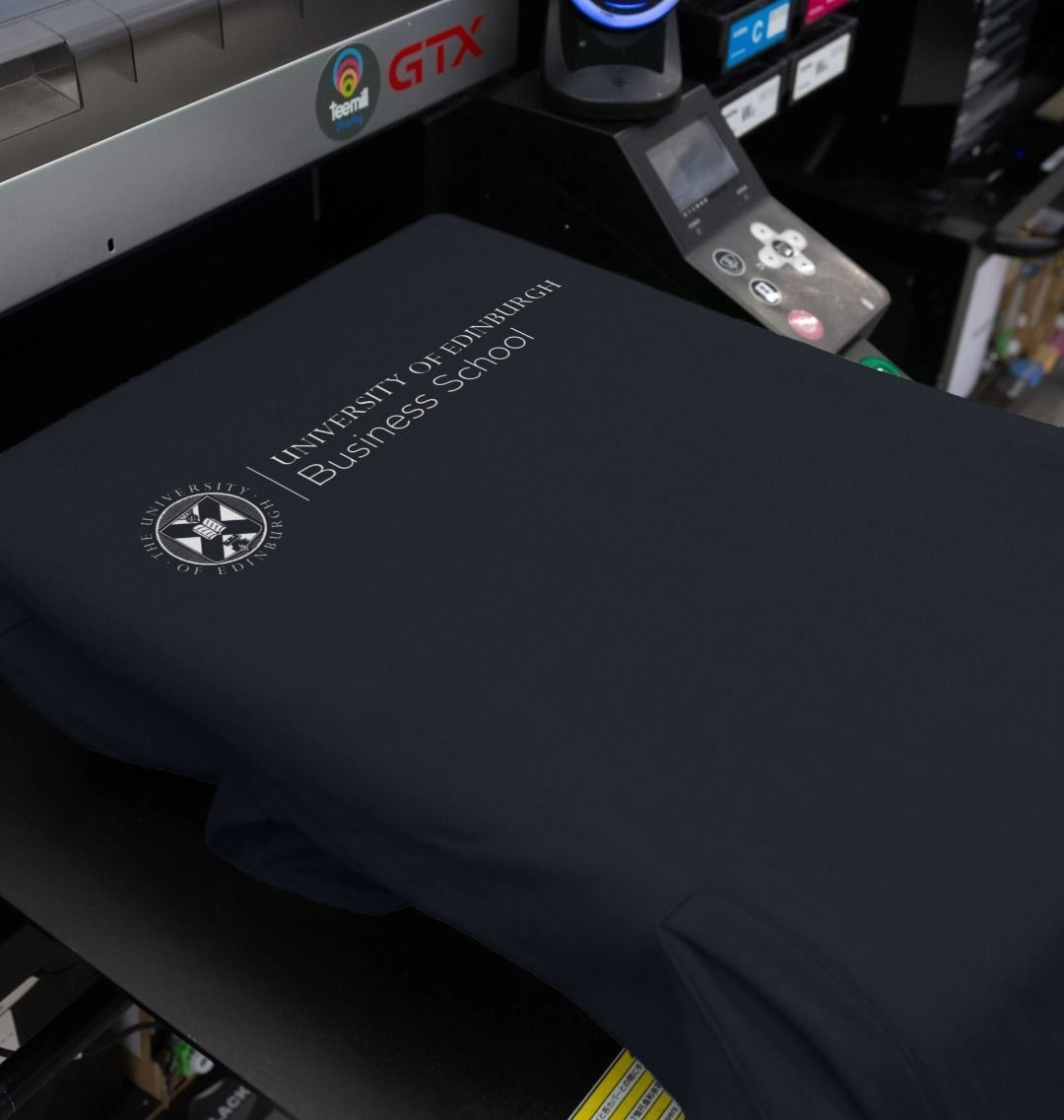 Our navy Business School Hoodie being printed by our print on demand partner, teemill.