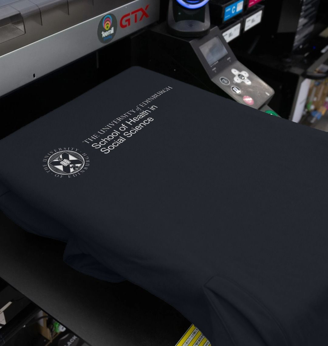 Our School of Health in Social Science  Hoodie being printed by our print on demand partner, teemill.