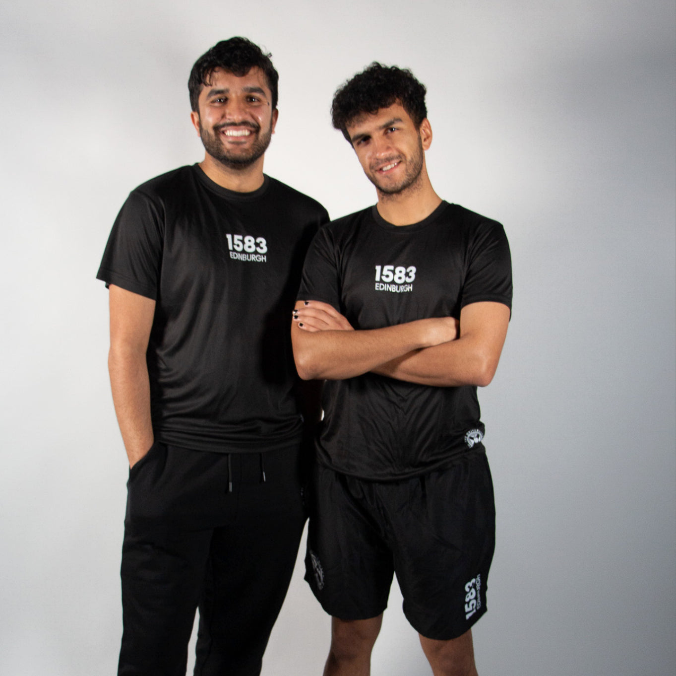 Our models both wear the recycled sports tshirt in black 
