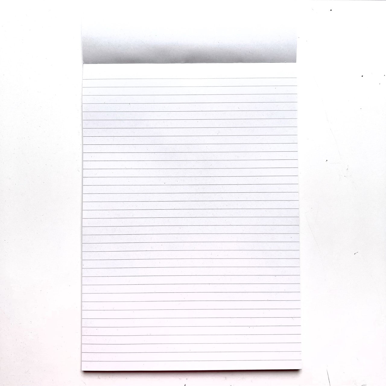 Ruled line paper from the inside of our A4 Recycled Notepad 