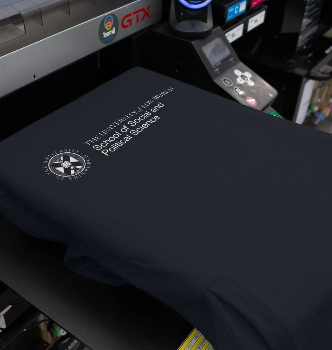 Our School of Social and Political Science Hoodie being printed by our print on demand partner, teemill.