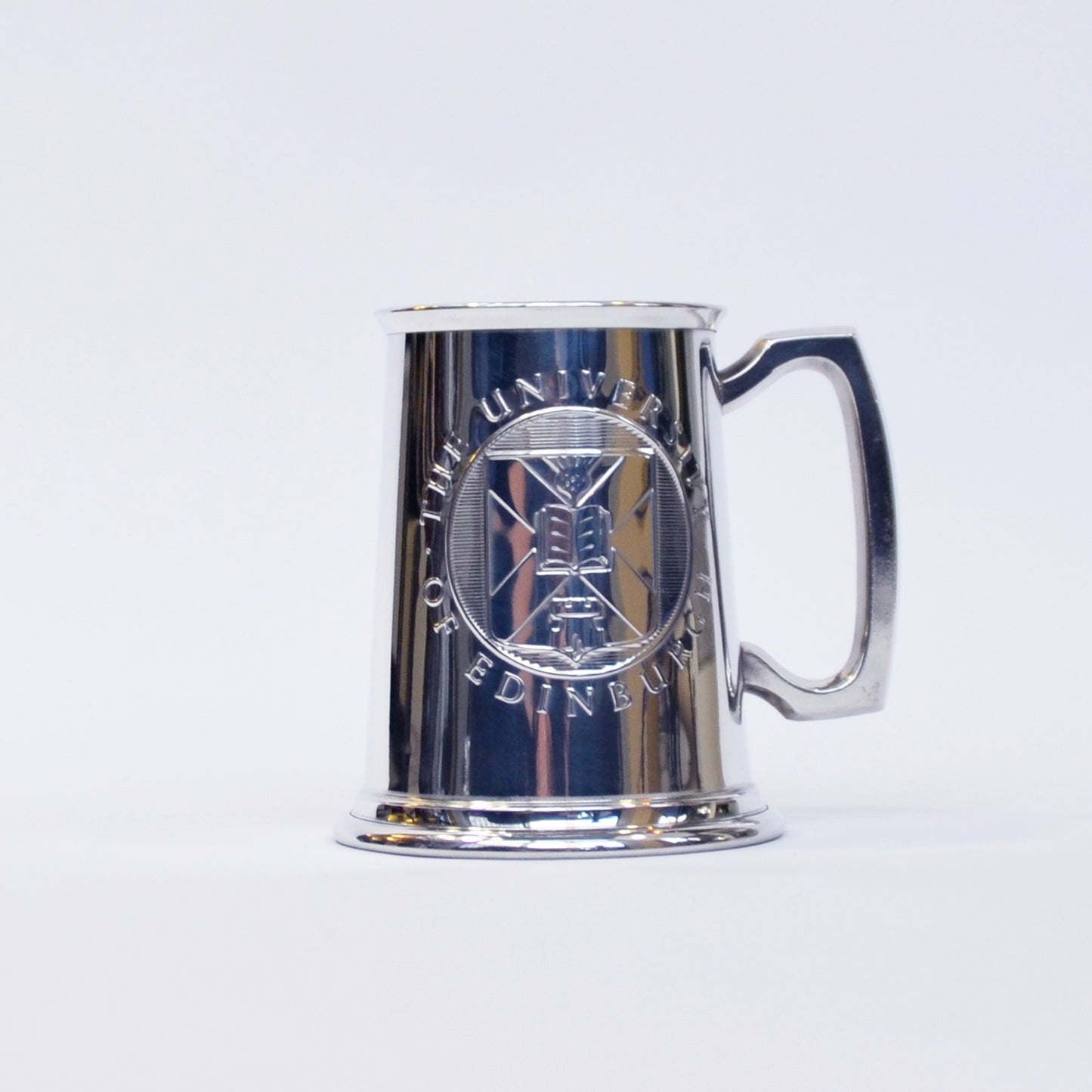 Front view of the pewter tankard, with the University crest visible