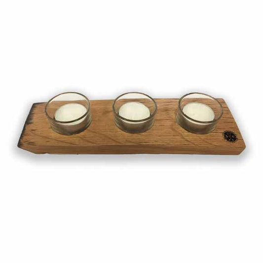 Triple tealight holder with laser engraved University crest in the bottom right corner with three tealights inside glass holders