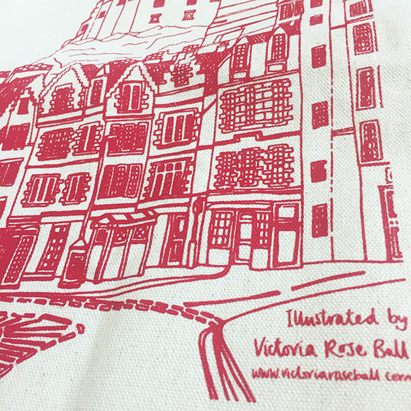 A close up of the illustration of Edinburgh Castle printed in red. Text reads: Illustrated by Victoria Rose Ball, www.victoriaroseball.com