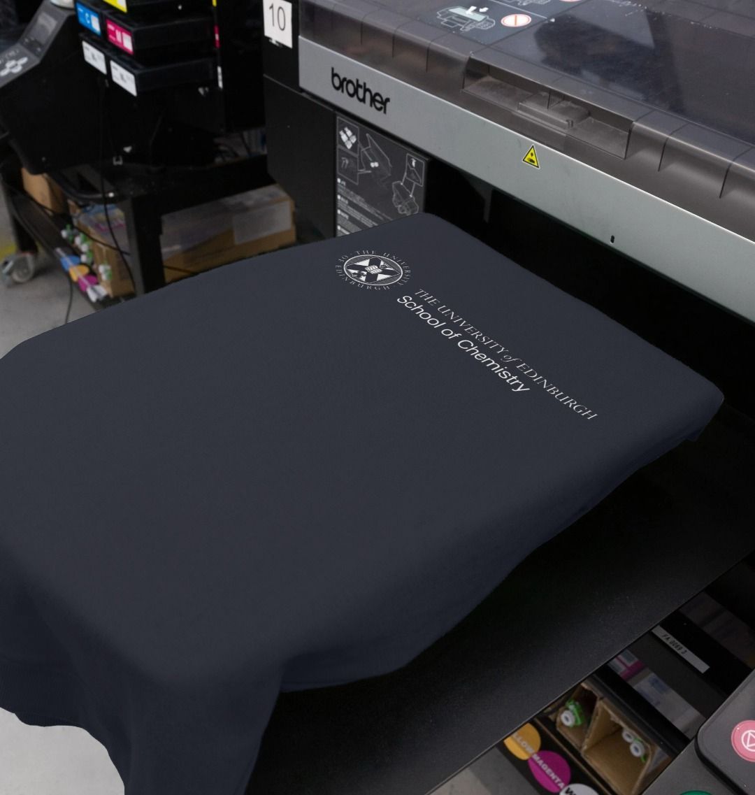 Our School of Chemistry navy sweatshirt being printed at our on demand partner, Teemill.